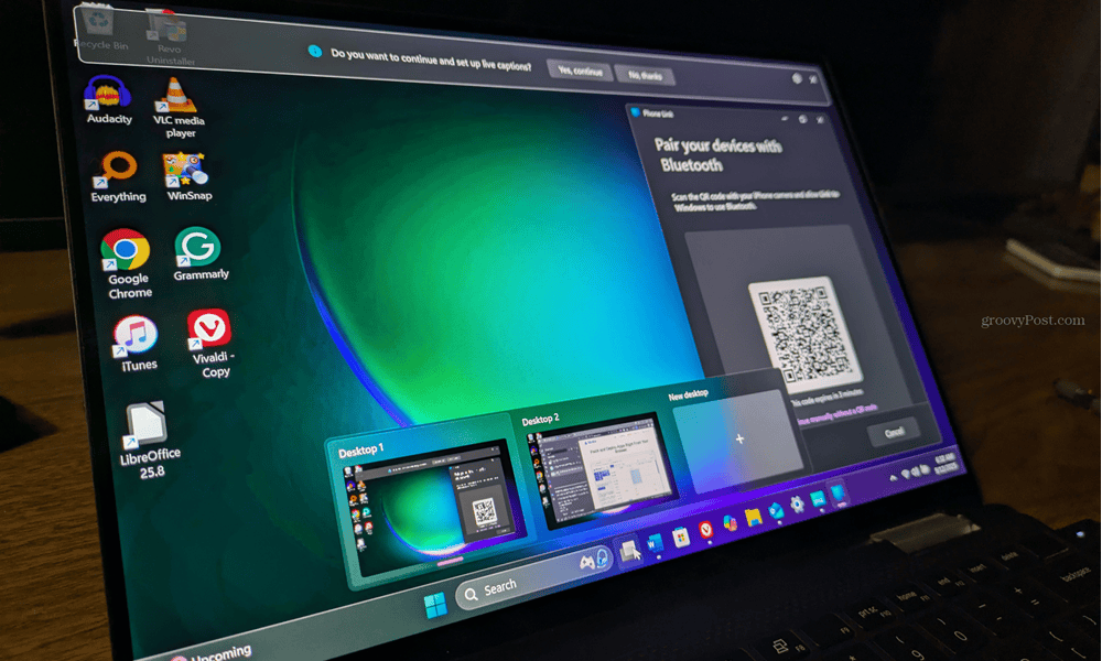 laptop running live captions phone link virtual desktops.png