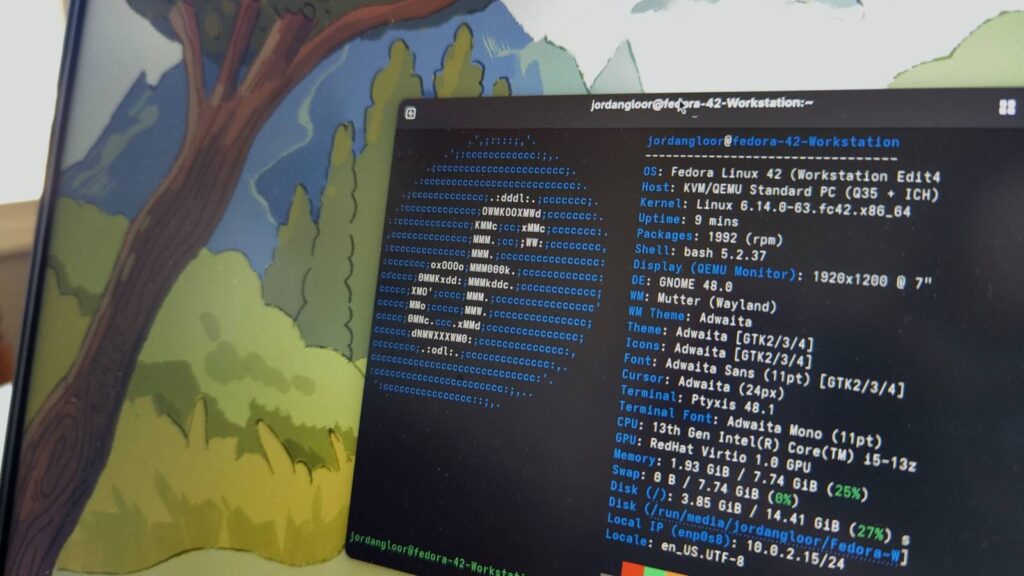 a laptop screen showing fedora linux 42 with a terminal open.jpg