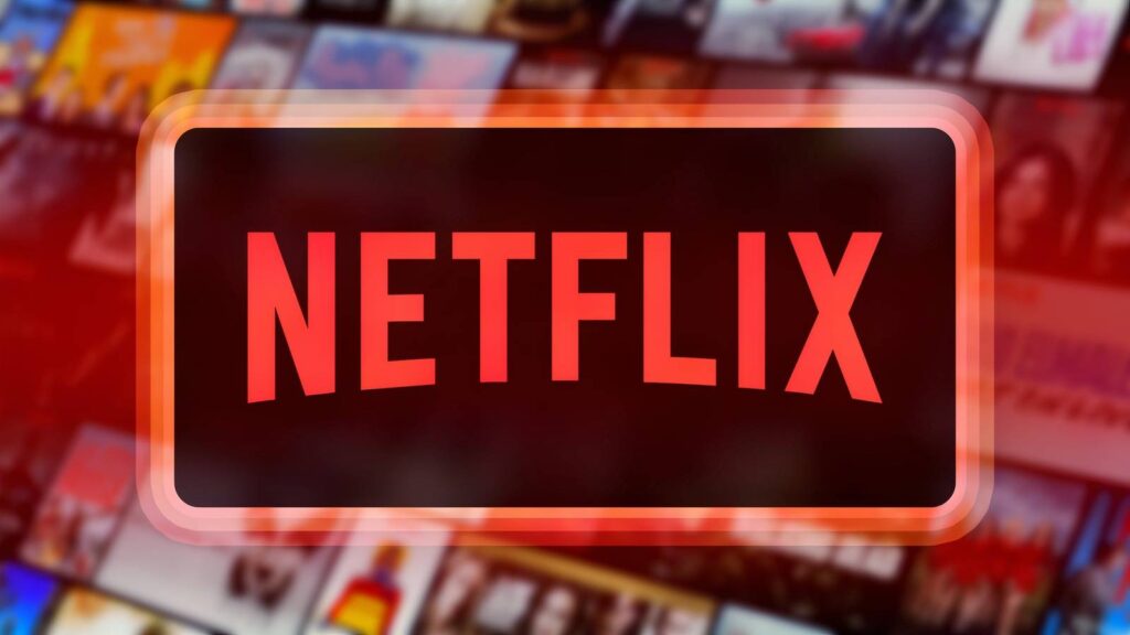 the netflix logo inside a glowing dark box against a blurred background of movie and tv show thumbna.jpeg