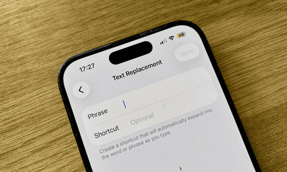 an iphone showing the text replacement screen.png
