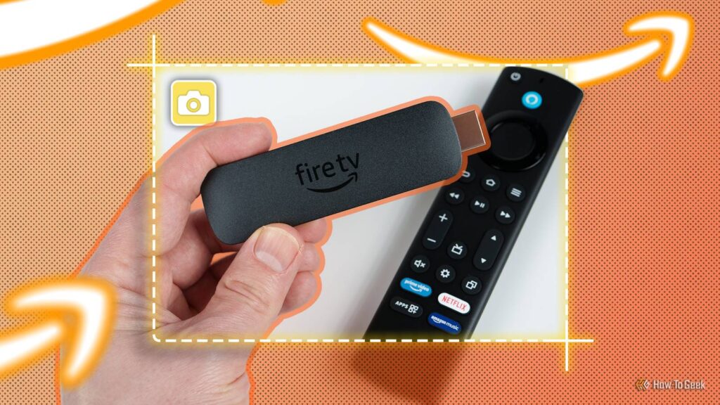 a hand holding an amazon fire tv stick with a screenshot icon in the center.jpg