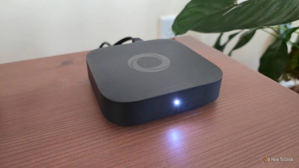 a homey pro mini smart home hub on a tv stand.jpg