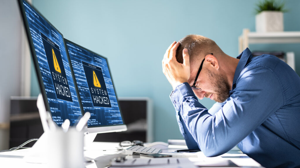 acronis hacked head holding.jpg