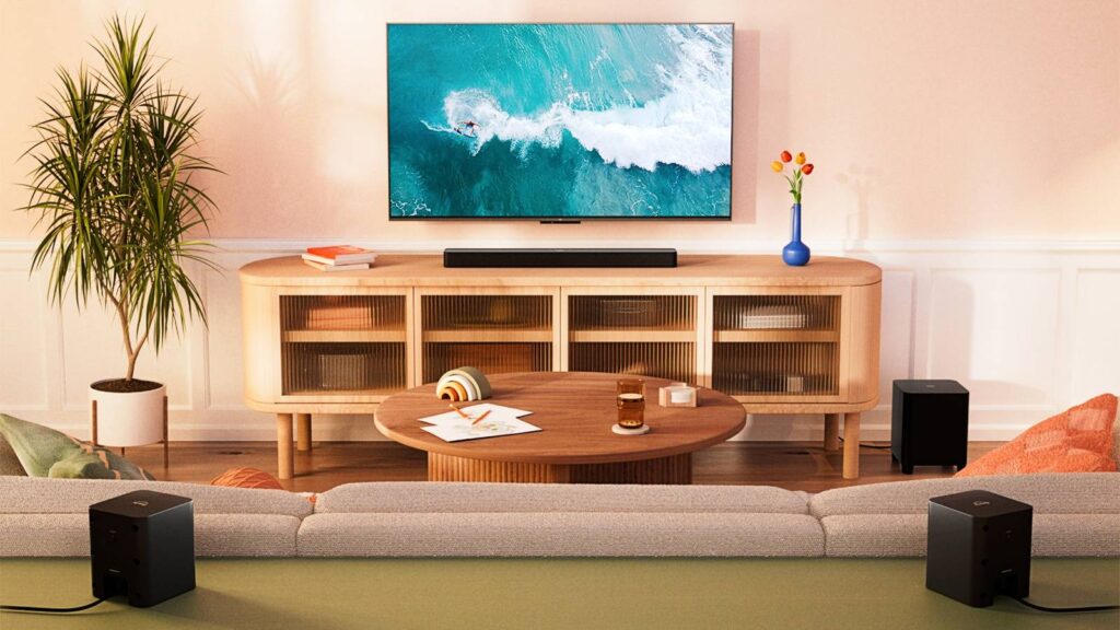 an amazon fire tv soundbar plus with built in subwoofer under a tv mounted on a wall.jpg
