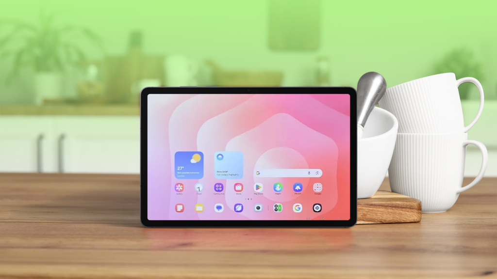 an android tablet on a wooden kitchen counter next to white ceramic cups and a pestle and mortar.png