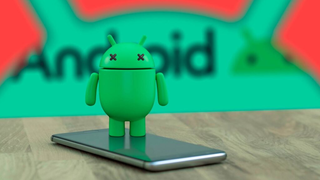 android mascot on top of a phone with x eyes indicating that it is dead and the android logo in the.jpeg