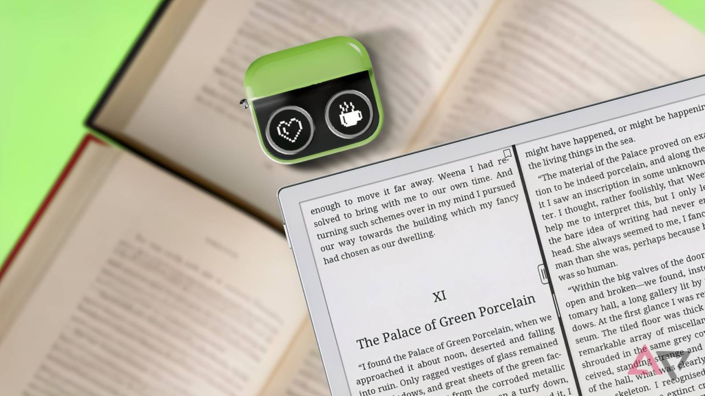 boox e reader with a boox tappy placed on top of open books.png