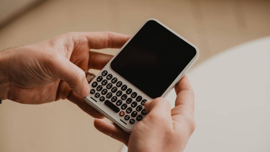 The Clicks Communicator is getting a major battery spice up and Android 17 proper out of the field clicks communicator hand.jpg