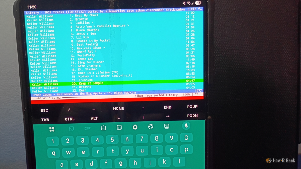 cmus running in on a samsung galaxy zfold 5 that s sitting on a table next to a black tablet case.pn .png