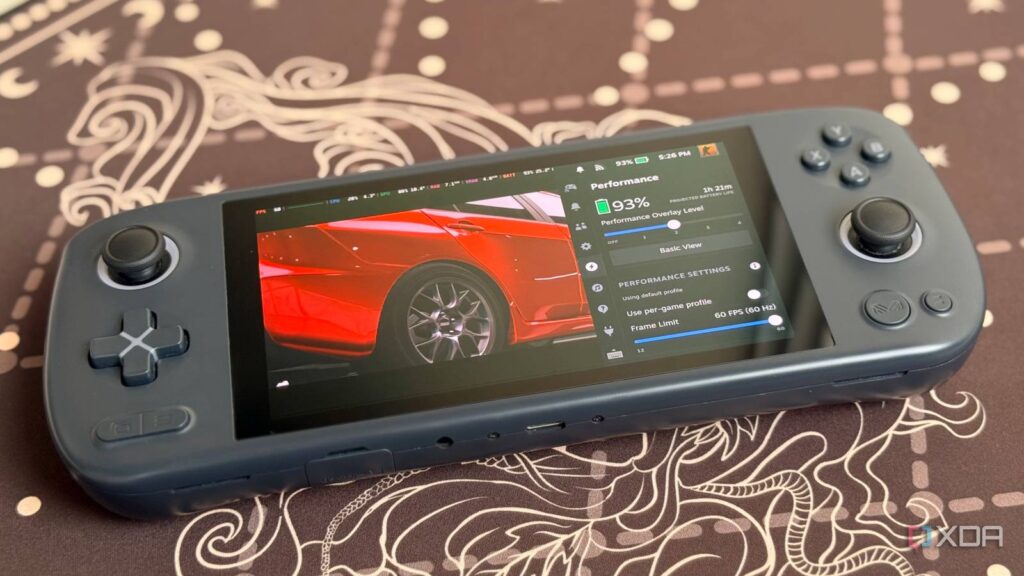 gaming handheld with battery percentage and performance settings on screen.jpg