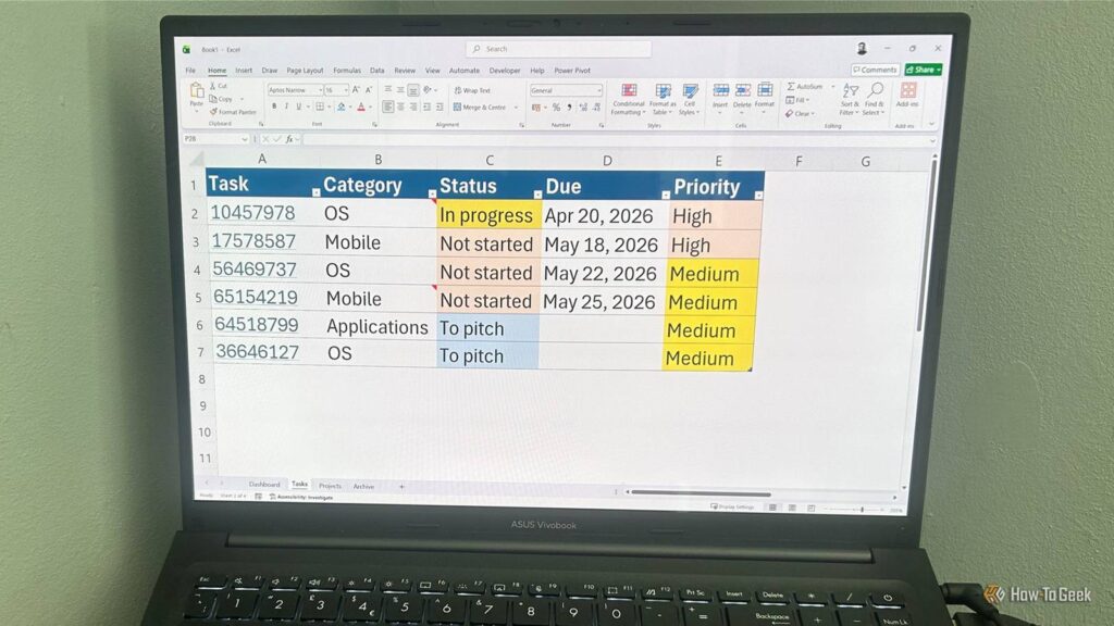laptop screen showing a task tracking excel spreadsheet.jpg