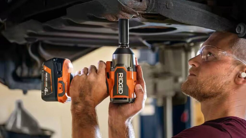man using ridgid on a car.jpg
