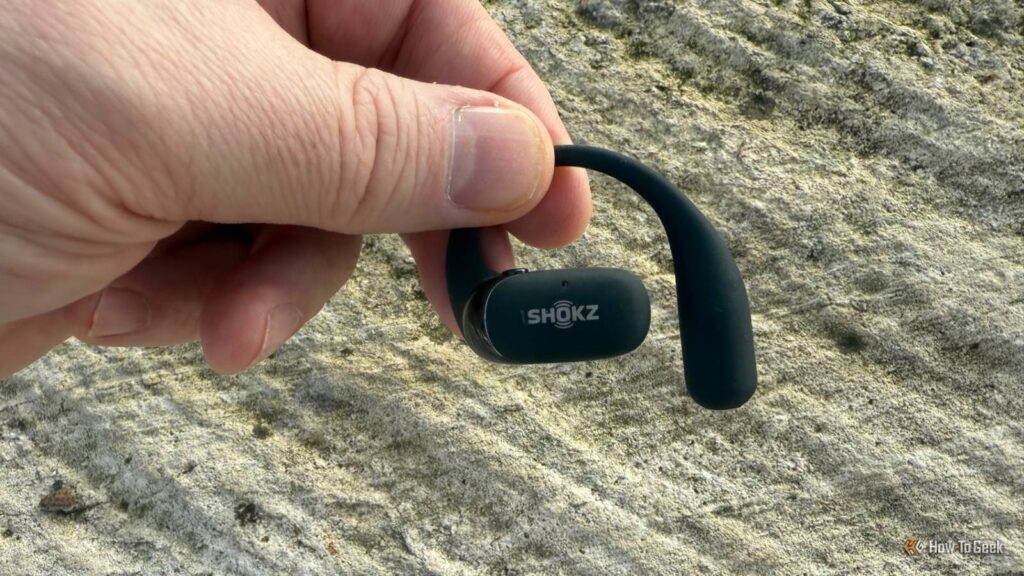 shokz openfit 2 in hand.jpg
