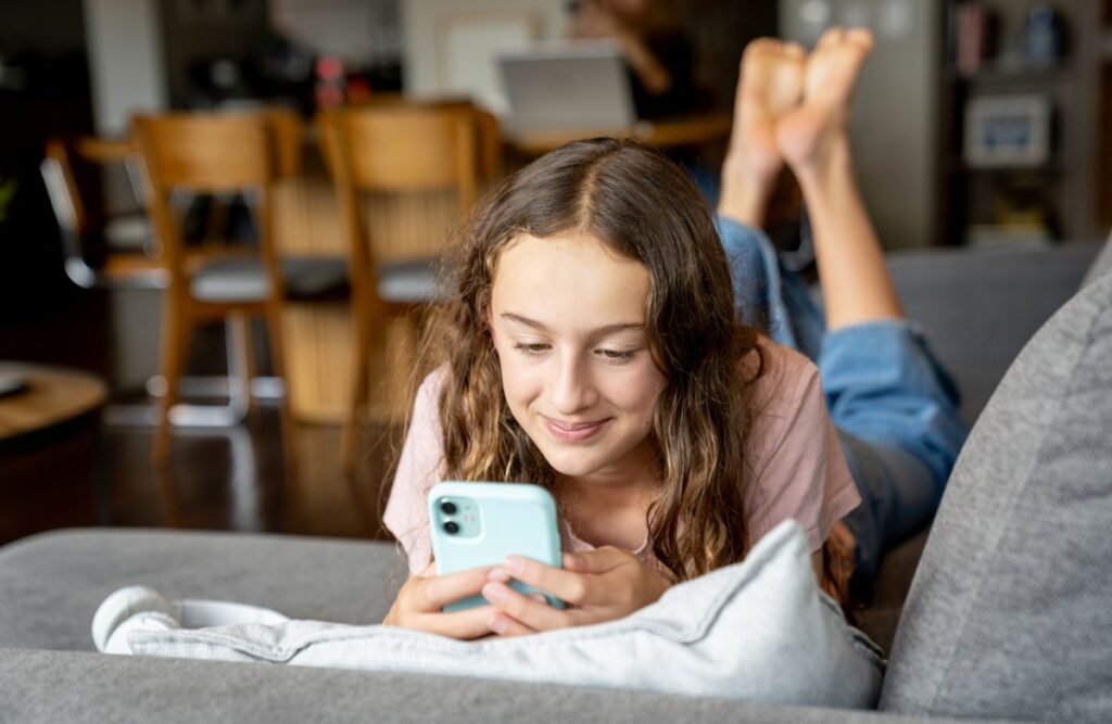 tween girl on phone gettyimages 2231040634.jpg