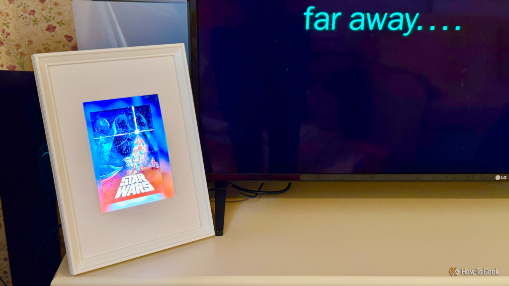 a framed ipad 2 screen showing the movie poster for star wars as the movie plays on the tv.png