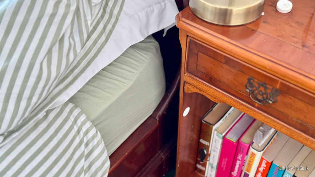 a nfc tag stuck to a nightstand next to a bed.png