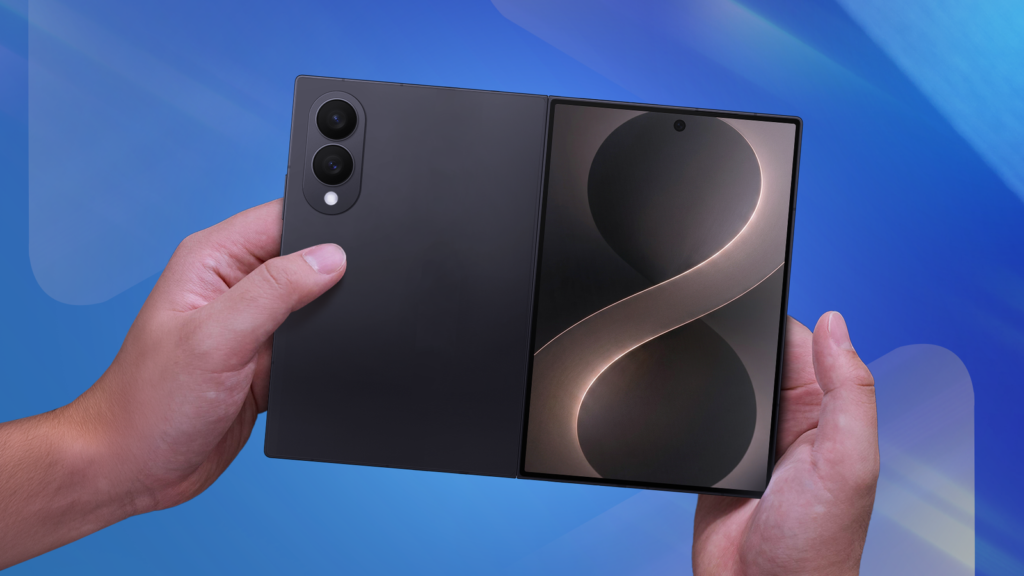 hands holding a samsung galaxy z fold 8 wide on a blue background.png
